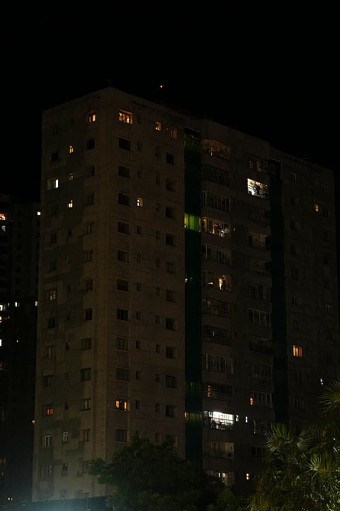 The lights of a residential building are seen turned off in protest against the alleged rape and murder of a trainee woman doctor at the RG Kar Medical College and Hospital, in Kolkata